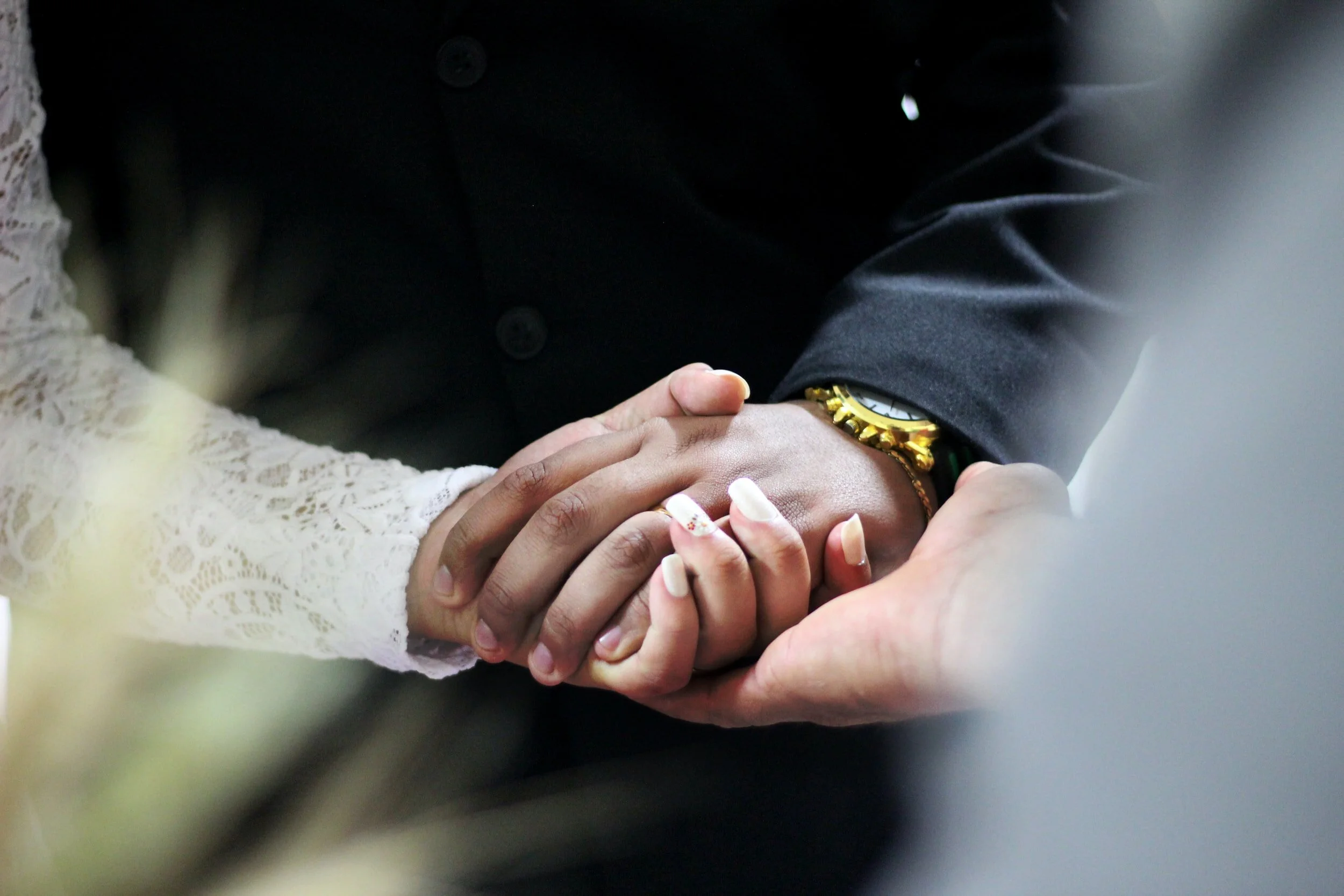  A couple holds hands after attending couples therapy in Miami with a couples therapist in Miami who also offers birth trauma therapy, counseling in Miami, marriage counseling in Miami and teen therapy in Miami.  