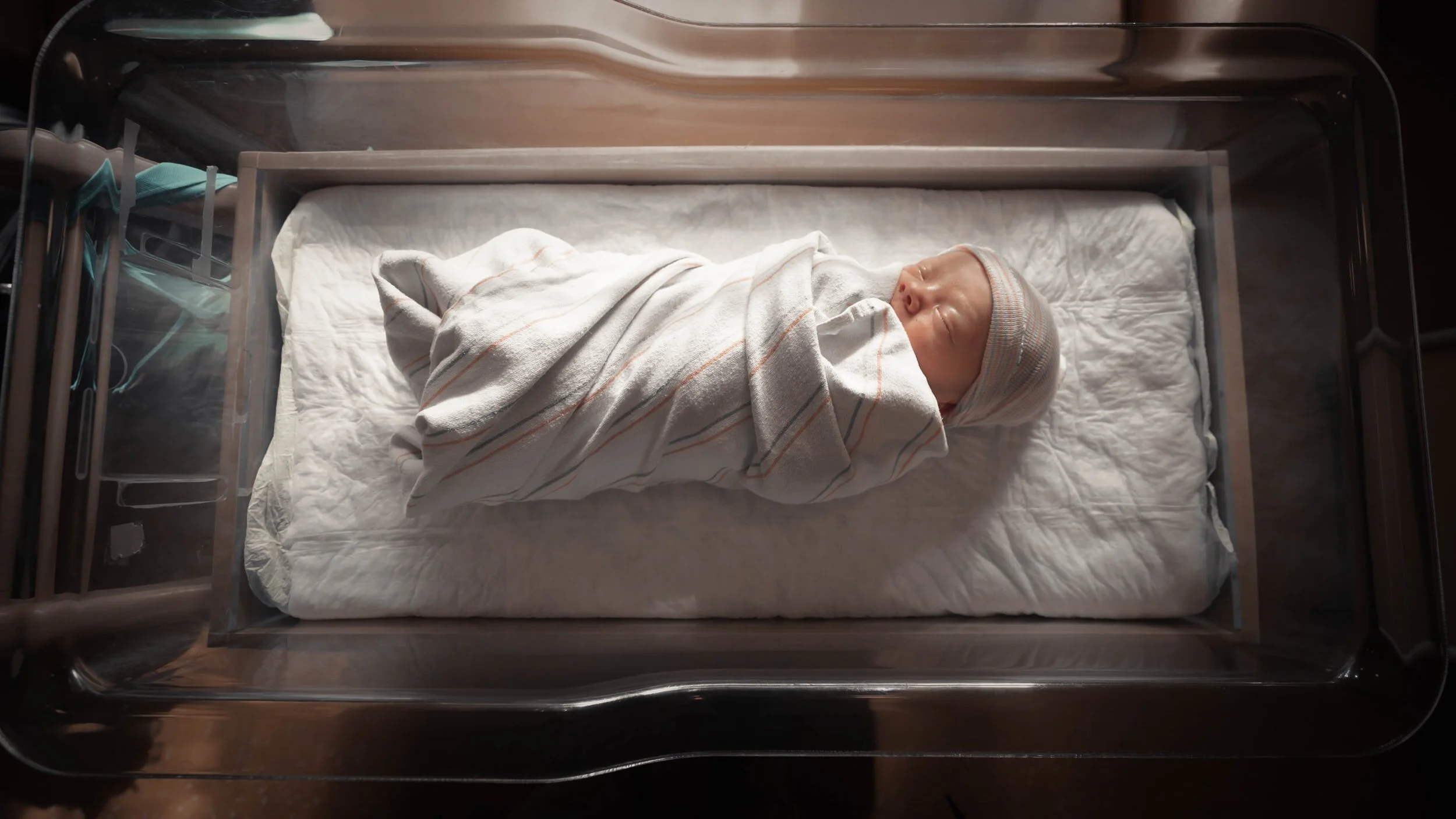 Baby sleeps after the traumatic birth where his mother experienced birth trauma and is in birth trauma therapy and couples counseling in Miami with April Brown, LMFT to help her heal from birth trauma and ptsd.