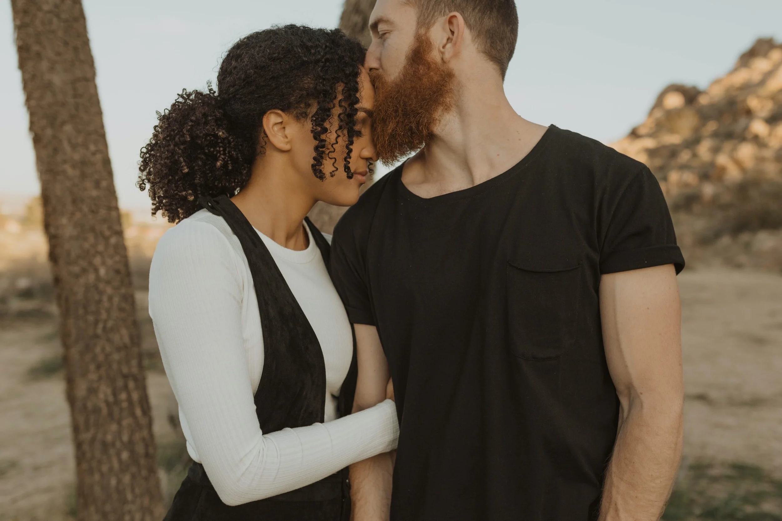 Couples embrace each other after attending online therapy in south florida with a Miami couples therapist who offers couples therapy in Miami, FL.